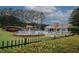 Community pool with mushroom water feature, lounge chairs and cabana overlooking greenery and blue skies at 365 Hunt Creek Dr, Acworth, GA 30101