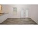 Bright dining area featuring wood-look floors, a window, and access to the patio at 365 Hunt Creek Dr, Acworth, GA 30101