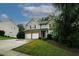 Well-kept 2-story house with brick accents, 2-car garage, and well-manicured front lawn at 365 Hunt Creek Dr, Acworth, GA 30101