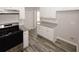 Galley kitchen with white cabinets, granite countertops, and stainless steel gas range at 365 Hunt Creek Dr, Acworth, GA 30101