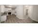 Spacious kitchen features granite counters, white cabinets and stainless steel appliances at 365 Hunt Creek Dr, Acworth, GA 30101