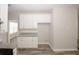 Bright kitchen includes ample cabinetry and granite counters at 365 Hunt Creek Dr, Acworth, GA 30101