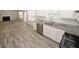 Open kitchen featuring stainless appliances, granite countertops and wood-look tile floor at 365 Hunt Creek Dr, Acworth, GA 30101