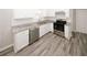 Updated kitchen with stainless steel dishwasher and gas range with white cabinets at 365 Hunt Creek Dr, Acworth, GA 30101
