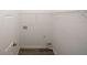 Functional laundry room with wood-look tile flooring and storage shelving at 365 Hunt Creek Dr, Acworth, GA 30101