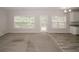 Bright living room with large windows, carpet flooring and view to the back deck at 365 Hunt Creek Dr, Acworth, GA 30101