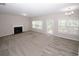 Spacious living room with a fireplace, carpet flooring and lots of natural light at 365 Hunt Creek Dr, Acworth, GA 30101