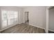 Bright living room featuring wood-look tile floor and natural light at 365 Hunt Creek Dr, Acworth, GA 30101