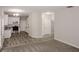 Open concept living room and kitchen with modern gray flooring and white cabinets at 365 Hunt Creek Dr, Acworth, GA 30101
