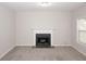 Spacious living room featuring a cozy fireplace and a bright window at 365 Hunt Creek Dr, Acworth, GA 30101