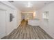 Open living room space featuring wood-look floors, neutral paint, and views into the kitchen at 365 Hunt Creek Dr, Acworth, GA 30101