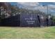 Bentwater pickleball courts fenced in with black netting and trees surrounding the courts at 365 Hunt Creek Dr, Acworth, GA 30101