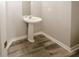 Cozy half bath with stylish pedestal sink and modern fixtures at 365 Hunt Creek Dr, Acworth, GA 30101