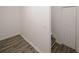 View of an empty room with wood-style tile flooring, white baseboards, and a double door closet at 365 Hunt Creek Dr, Acworth, GA 30101