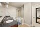 Elegant bathroom with double vanity, granite countertop, glass shower, and separate bathtub at 44 Peachtree Ne Pl # 1824, Atlanta, GA 30309