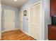 Inviting entryway featuring hardwood floors and a closet with louvered doors at 44 Peachtree Ne Pl # 1824, Atlanta, GA 30309