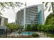 Upscale high-rise condo building with pool and manicured grounds in a vibrant neighborhood at 44 Peachtree Ne Pl # 1824, Atlanta, GA 30309