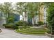 Landscaped green space with seating area and trees at 44 Peachtree Ne Pl # 1824, Atlanta, GA 30309