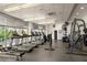 Well-equipped fitness center with treadmills, weight machines, and mirrored walls for residents at 44 Peachtree Ne Pl # 1824, Atlanta, GA 30309