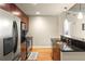 Modern kitchen with stainless steel appliances, granite countertops, tiled backsplash, and breakfast bar at 44 Peachtree Ne Pl # 1824, Atlanta, GA 30309