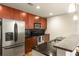 Modern kitchen with stainless steel appliances, granite countertops, tiled backsplash, and breakfast bar at 44 Peachtree Ne Pl # 1824, Atlanta, GA 30309