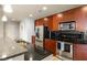 Modern kitchen with stainless steel appliances, granite countertops, tiled backsplash, and breakfast bar at 44 Peachtree Ne Pl # 1824, Atlanta, GA 30309