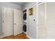 Convenient laundry closet with stacked washer and dryer units at 44 Peachtree Ne Pl # 1824, Atlanta, GA 30309