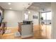 Bright condo living space featuring an open kitchen, hardwood floors, and large windows with city views at 44 Peachtree Ne Pl # 1824, Atlanta, GA 30309