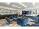 Luxurious resident lounge with comfortable blue seating, stylish decor, and ample natural light at 44 Peachtree Ne Pl # 1824, Atlanta, GA 30309