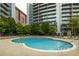 Outdoor pool with lounge chairs and landscaped surroundings at 44 Peachtree Ne Pl # 1824, Atlanta, GA 30309