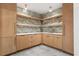 Finished basement features modern light wood cabinets, open shelving, and tile flooring at 612 Champions Dr, Mcdonough, GA 30253