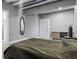 Modern bedroom featuring sleek furniture, unique ceiling detail, and closet with storage at 612 Champions Dr, Mcdonough, GA 30253
