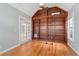 Spacious bedroom featuring a large built in bookcase and hardwood floors at 612 Champions Dr, Mcdonough, GA 30253