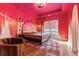 Bedroom with hardwood floors, modern furnishings, and a statement wall at 612 Champions Dr, Mcdonough, GA 30253