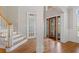 Inviting foyer featuring hardwood floors and a beautiful staircase at 612 Champions Dr, Mcdonough, GA 30253