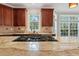 Kitchen island with gas range and granite counters at 612 Champions Dr, Mcdonough, GA 30253