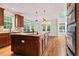 Spacious kitchen with granite counters, custom cabinets and stainless appliances at 612 Champions Dr, Mcdonough, GA 30253