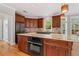 Gourmet kitchen island with granite countertop, double oven, and ample storage space at 612 Champions Dr, Mcdonough, GA 30253