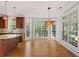 Kitchen nook featuring hardwood floors and large windows with backyard views at 612 Champions Dr, Mcdonough, GA 30253