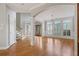 Inviting living room with hardwood floors, large windows, and elegant columns at 612 Champions Dr, Mcdonough, GA 30253