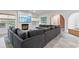 Spacious living room with modern furniture, fireplace, and bright windows offering natural light at 612 Champions Dr, Mcdonough, GA 30253