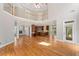 Spacious living room with hardwood floors, high ceilings, and balcony overlook at 612 Champions Dr, Mcdonough, GA 30253