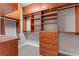 Walk-in closet with custom shelving and drawers for optimal storage at 612 Champions Dr, Mcdonough, GA 30253