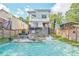 This backyard features a pool, lounge seating, privacy fencing, and landscaping at 120 Vanira Se Ave, Atlanta, GA 30315