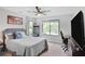 This bedroom features a window, a comfortable bed, and desk setup at 120 Vanira Se Ave, Atlanta, GA 30315