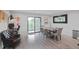 Bright dining area with a sliding glass door to a balcony and modern decor at 120 Vanira Se Ave, Atlanta, GA 30315