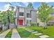 Modern two-story home with a red front door, stone accents and landscaped front yard at 120 Vanira Se Ave, Atlanta, GA 30315