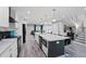 Bright open kitchen with large island, modern appliances, and sleek white cabinets overlooks the spacious living area at 120 Vanira Se Ave, Atlanta, GA 30315