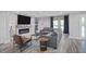 Comfortable living room with a gray sofa, fireplace, recessed lights, and stylish decor at 120 Vanira Se Ave, Atlanta, GA 30315