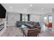 Comfortable living room with a gray sofa, fireplace, recessed lights, and stylish decor at 120 Vanira Se Ave, Atlanta, GA 30315